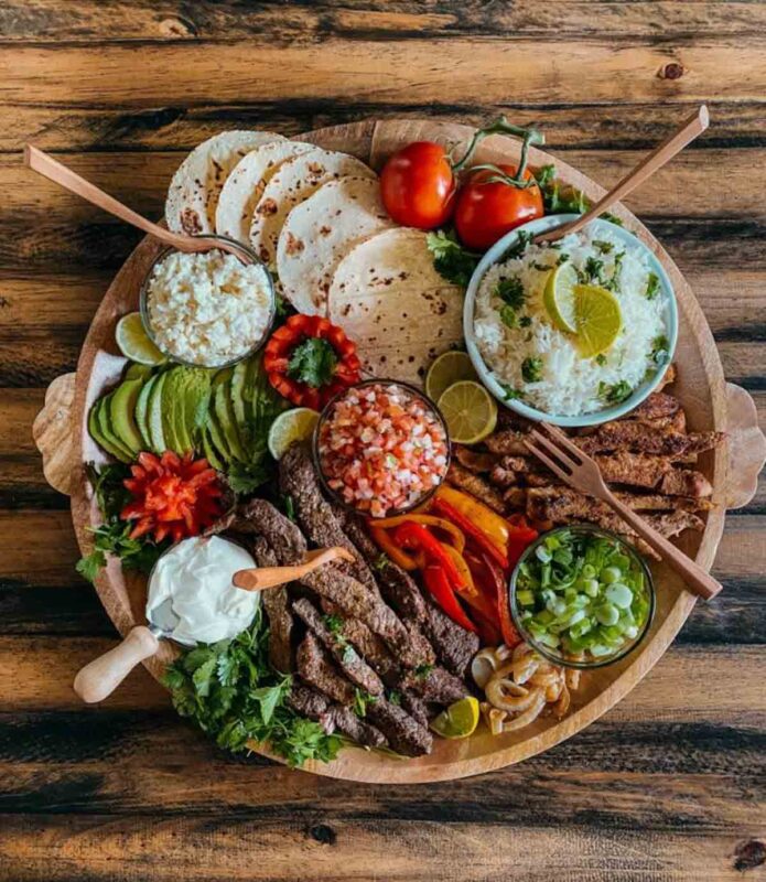 fajita toppings and meat on circular tray