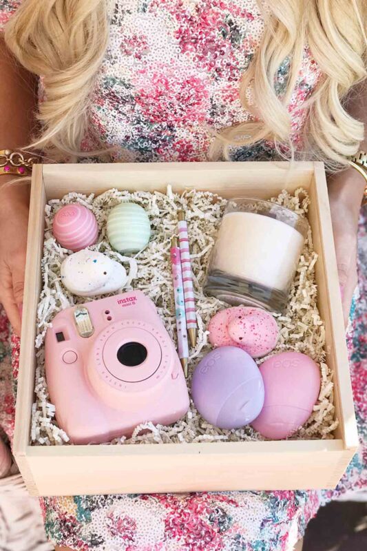 wooden box with camera and chapstick