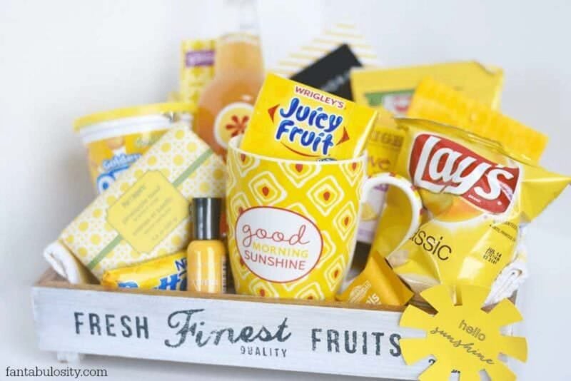box full of yellow treats and snacks