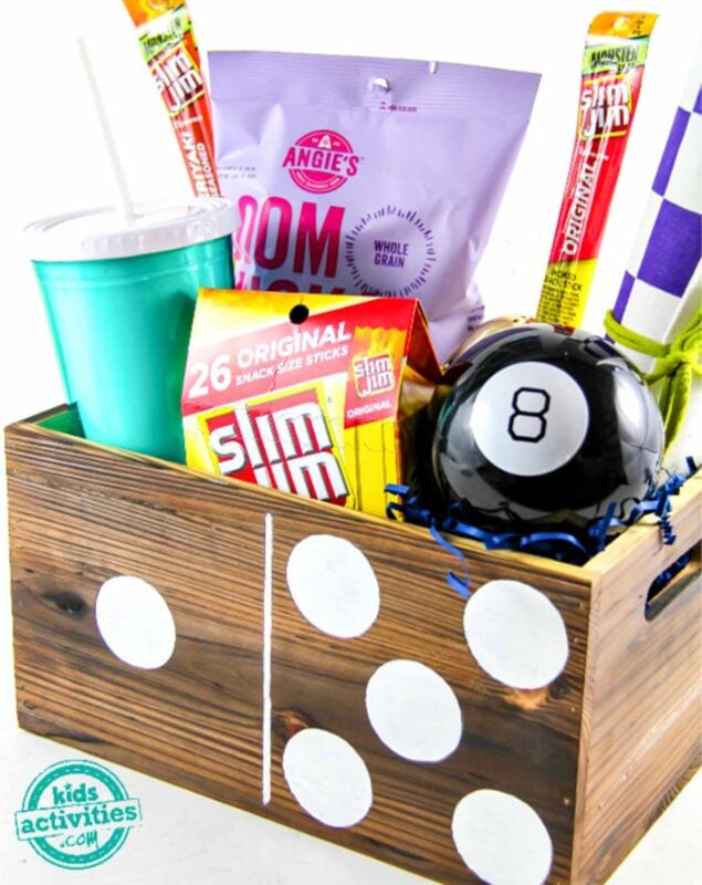 wooden box with snacks and water bottle