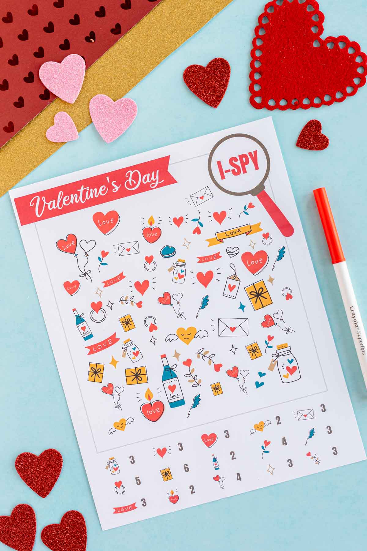 printed out Valentines i spy sheet with hearts around it