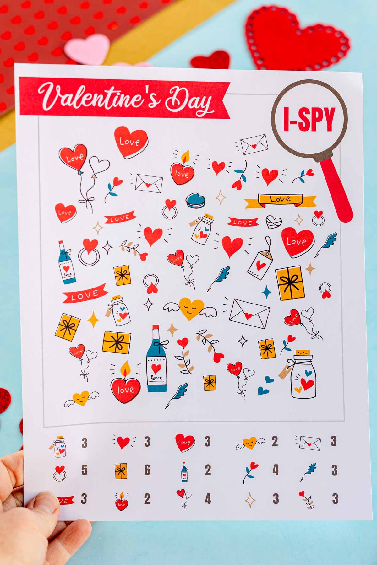 Valentine i spy sheet in someone's hand