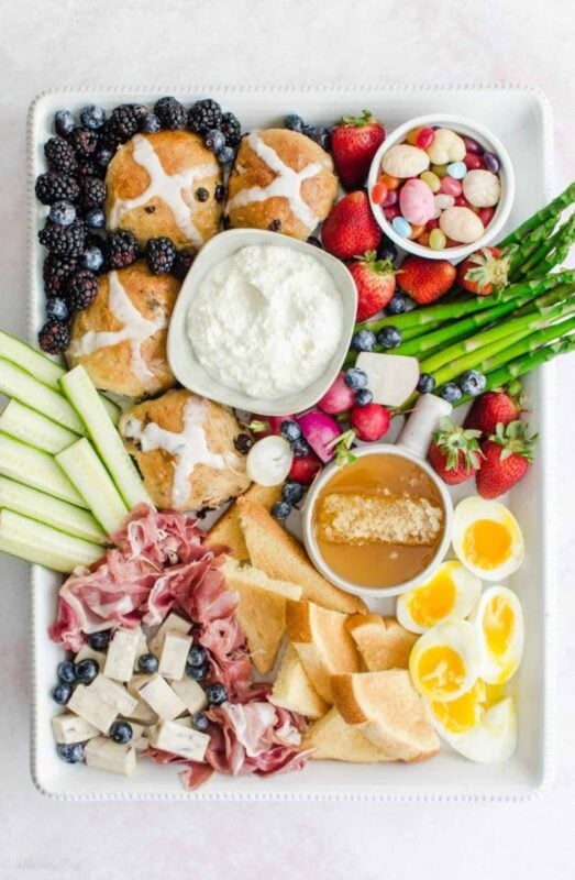 tray with hot buns fruits and other breakfast items