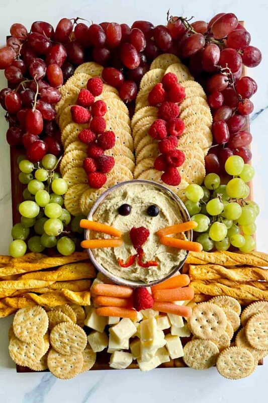 board with bunny dip and cracker ears and other fruits