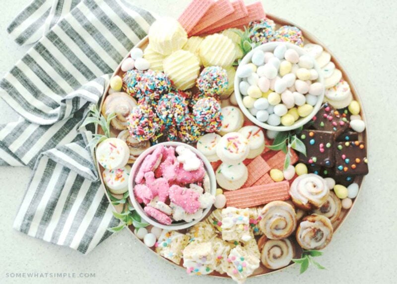 dessert board with variety of brightly colored sweet treats