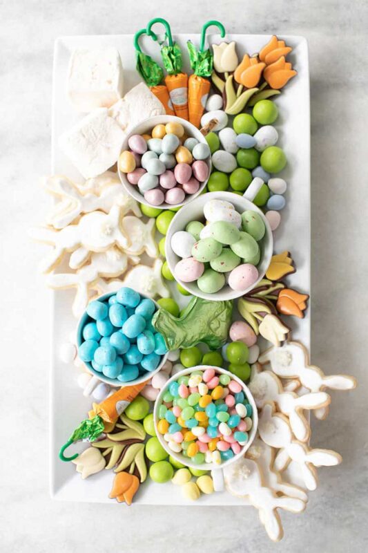 plate with easter candies and bunny sugar cookies