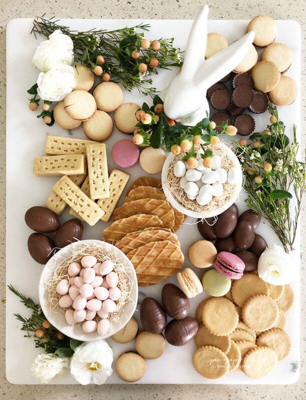 white baord with egg candies and other sweet treats