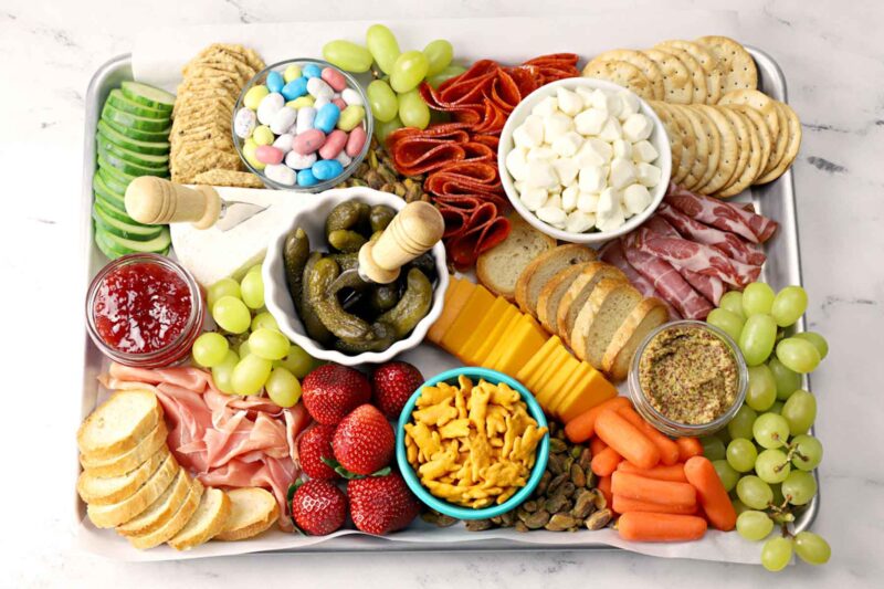 serving tray with meats fruits veggies and crackers