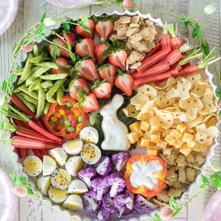 round tray with healthy snacks and chocolate bunny center