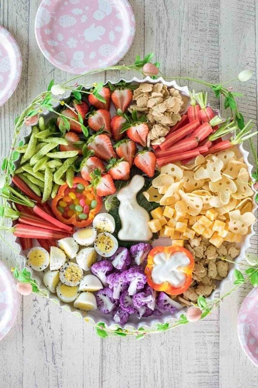 round tray with healthy snacks and chocolate bunny center