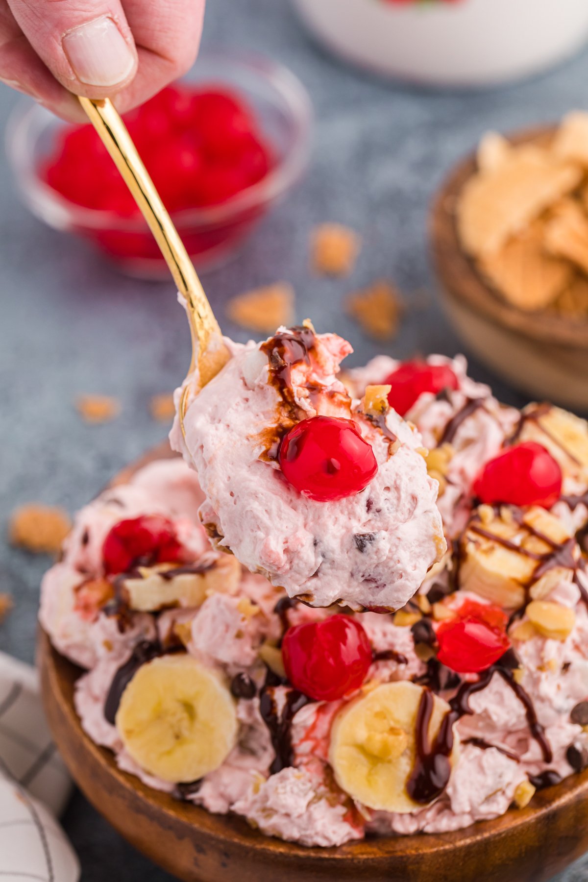 wooden bowl with a spoon full of banana split fluff