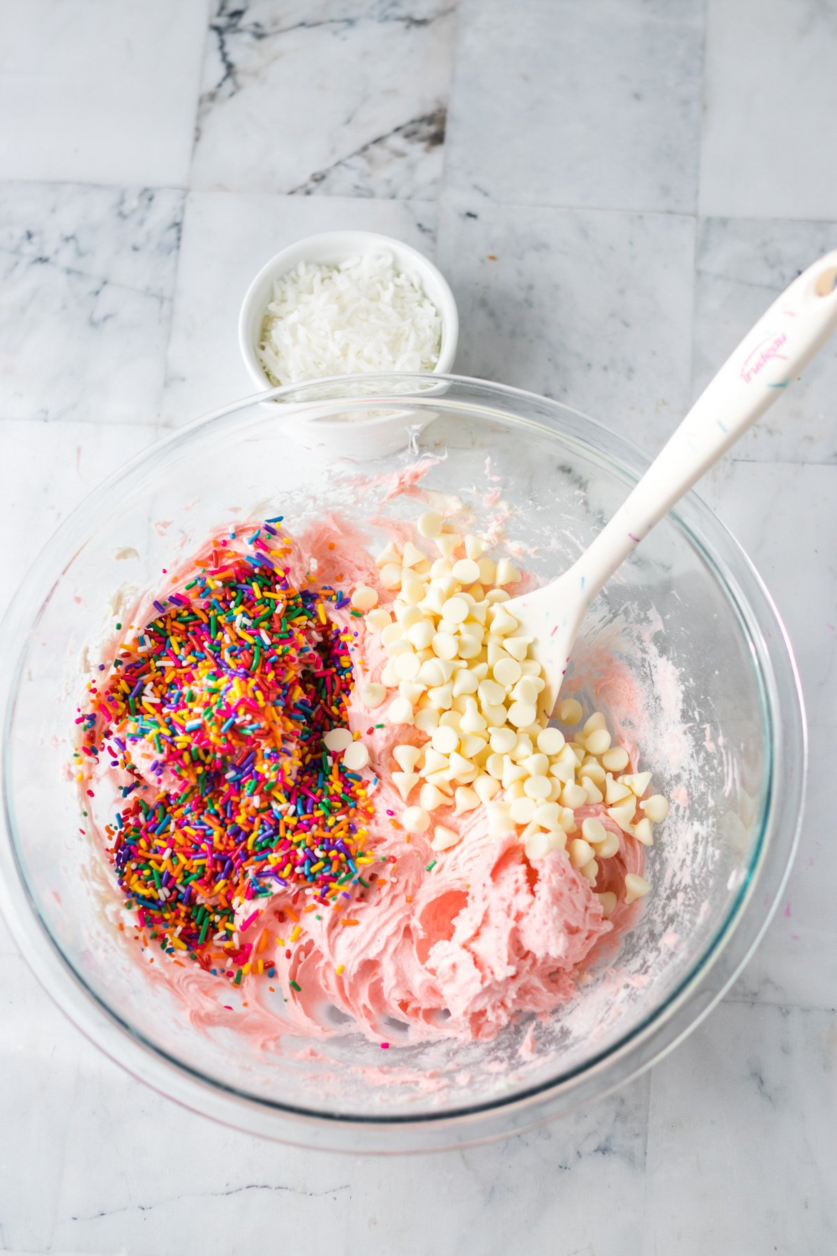 chocolate chips and funfetti dip in a glass bowl