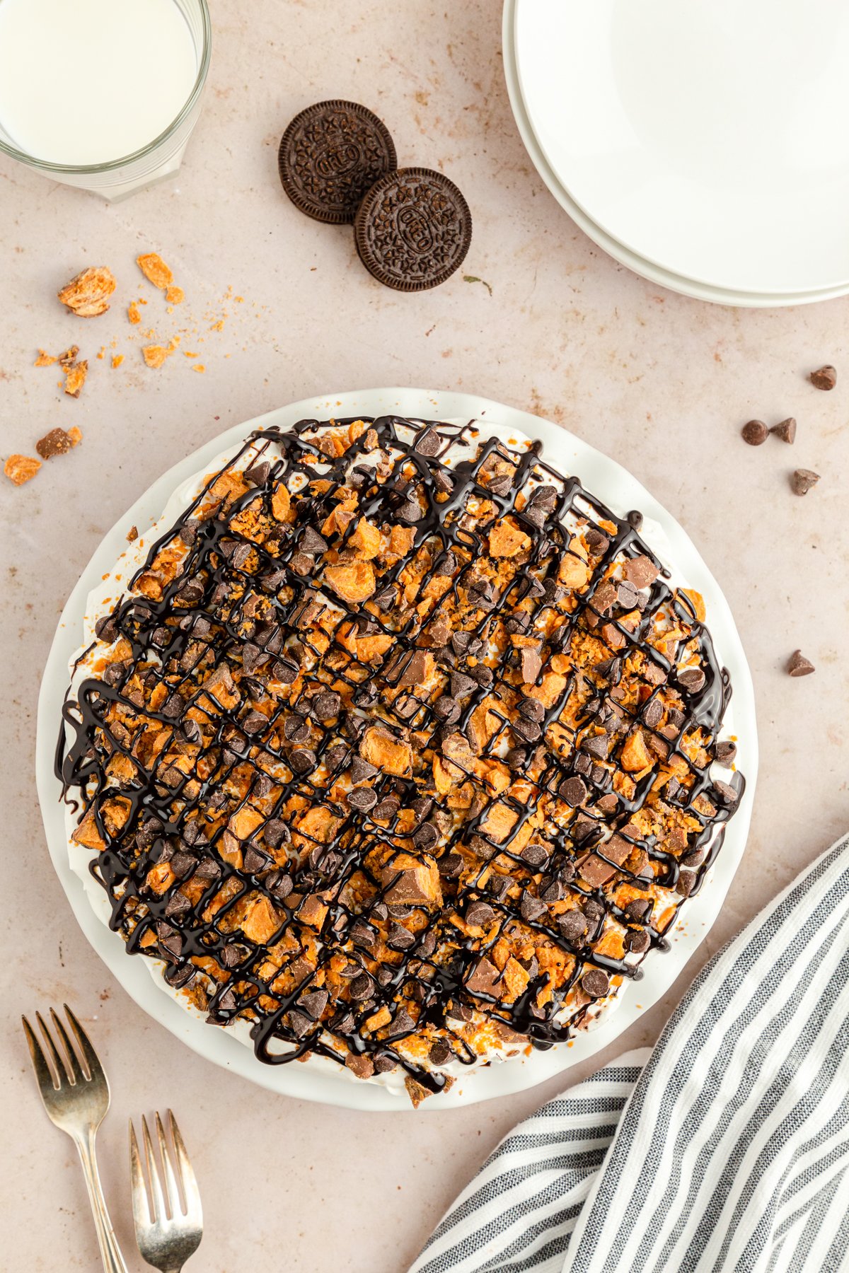 butterfinger pie drizzled with chocolate syrup