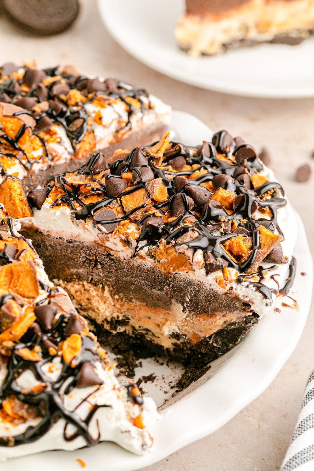 pulling a slice of butterfinger pie out of a pie dish