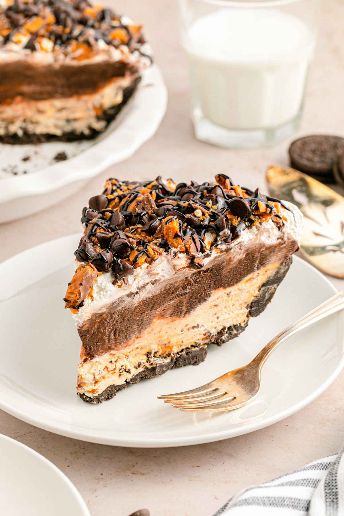 a slice of butterfinger pie on a white plate