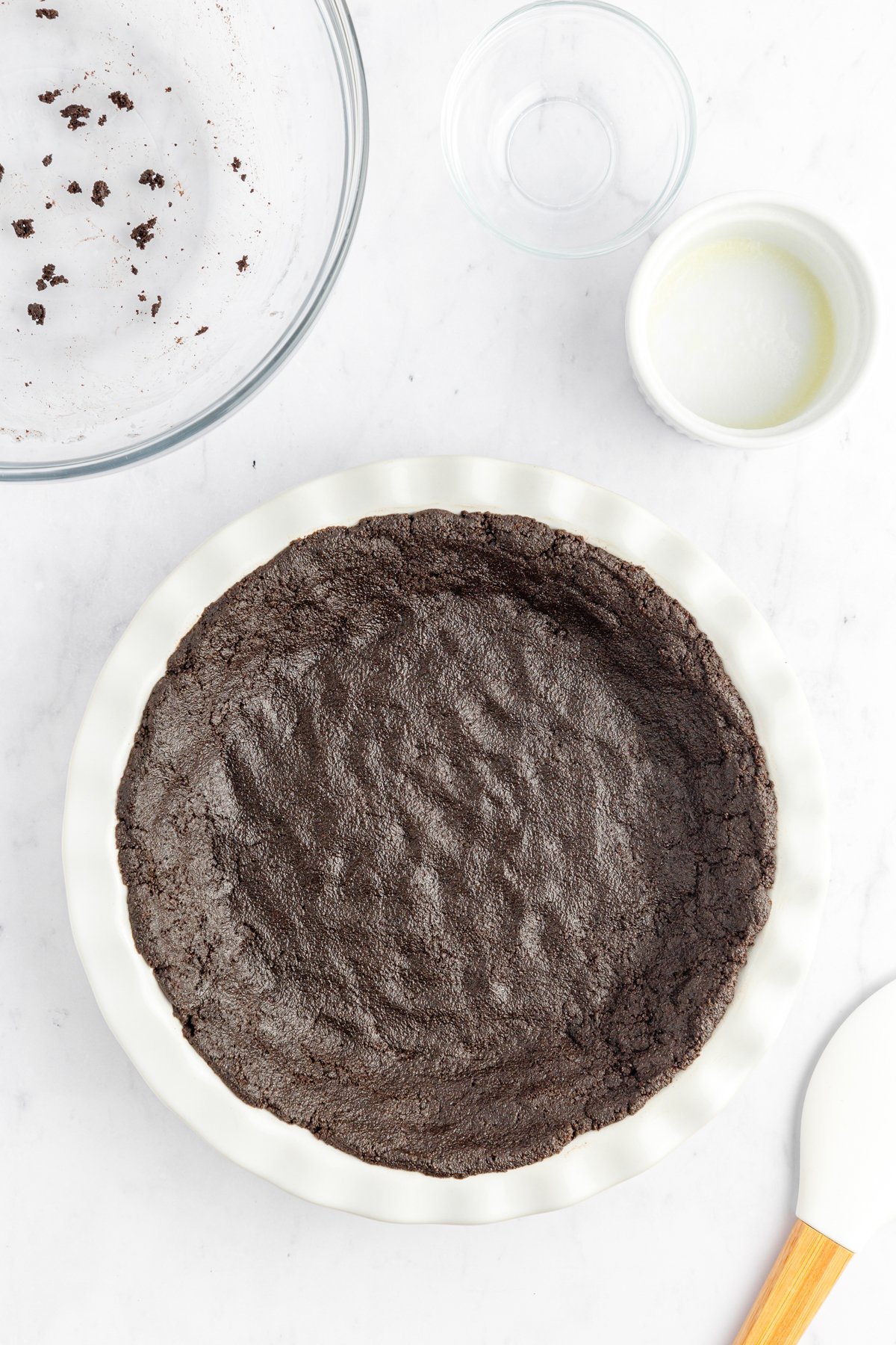 Oreo pie crust in a pie dish