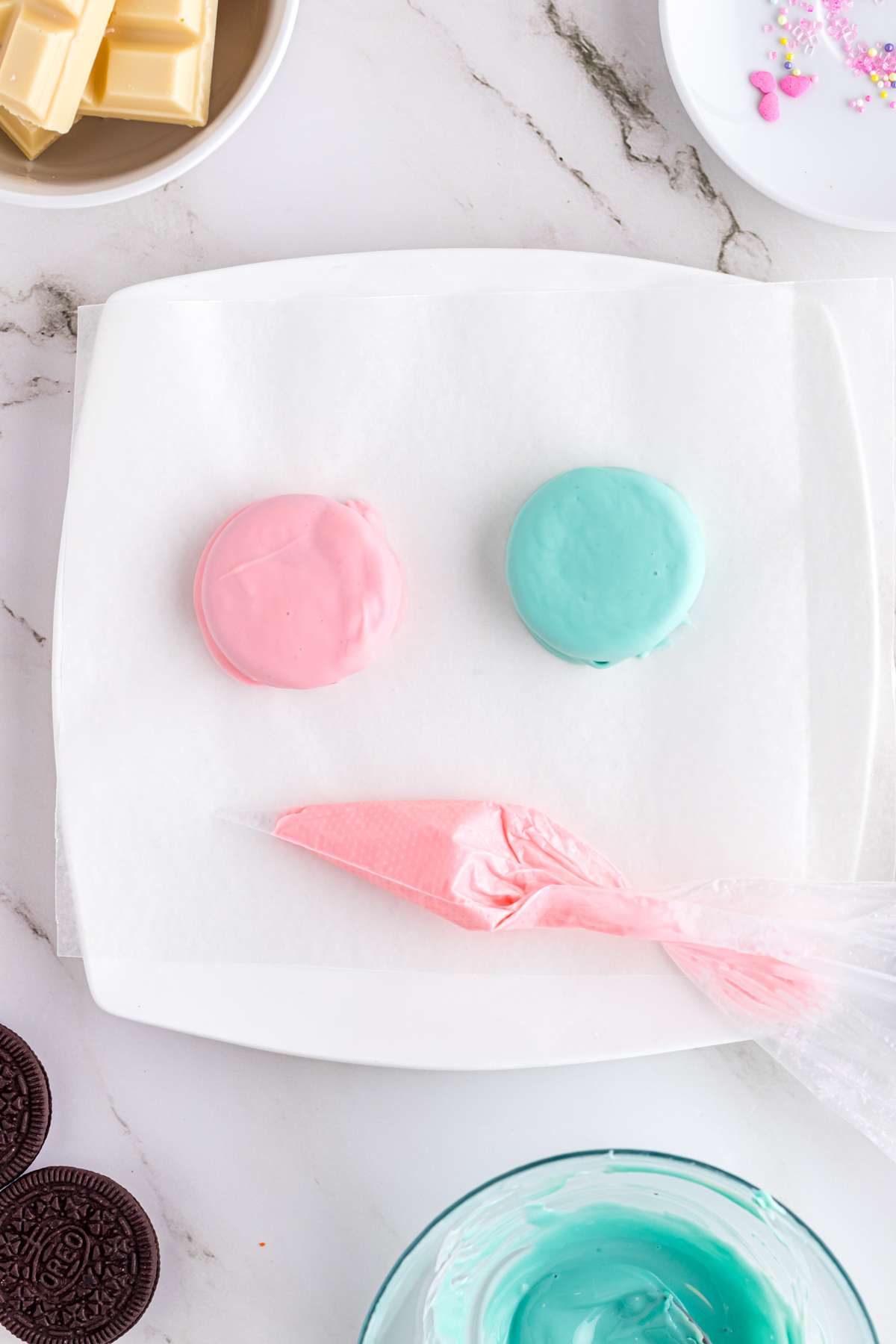 pink and blue chocolate covered Oreos