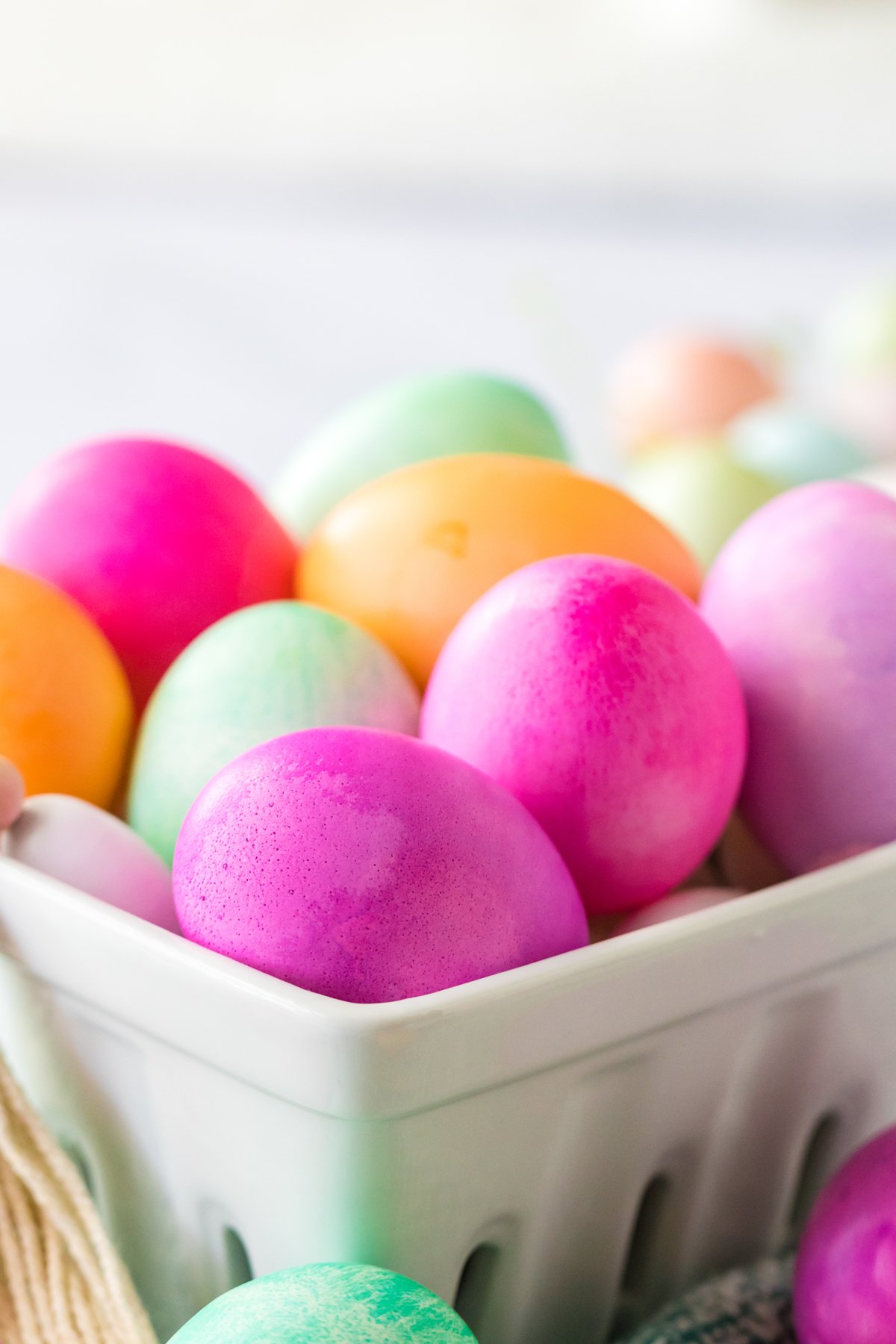 bowl of dyed eggs in various colors
