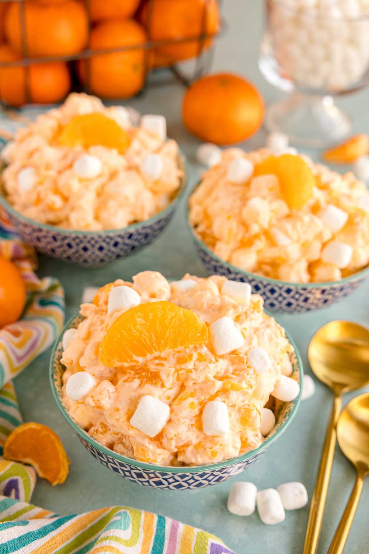 small blue bowls of orange fluff salad