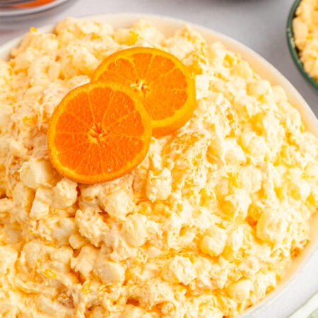 white bowl of orange fluff salad