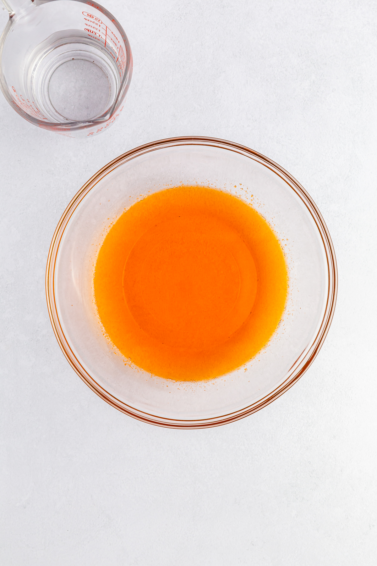 glass bowl with orange jello