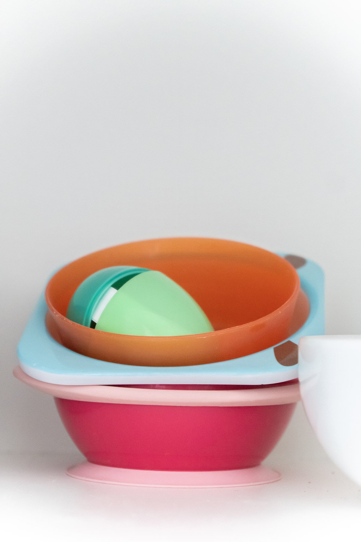 Easter egg hidden in a plastic bowl