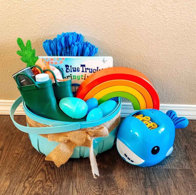 blue basket with rainbow toy and bubble maker