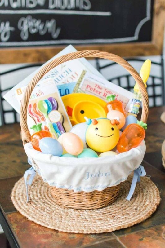 baby easter basket with baby toys and spoons