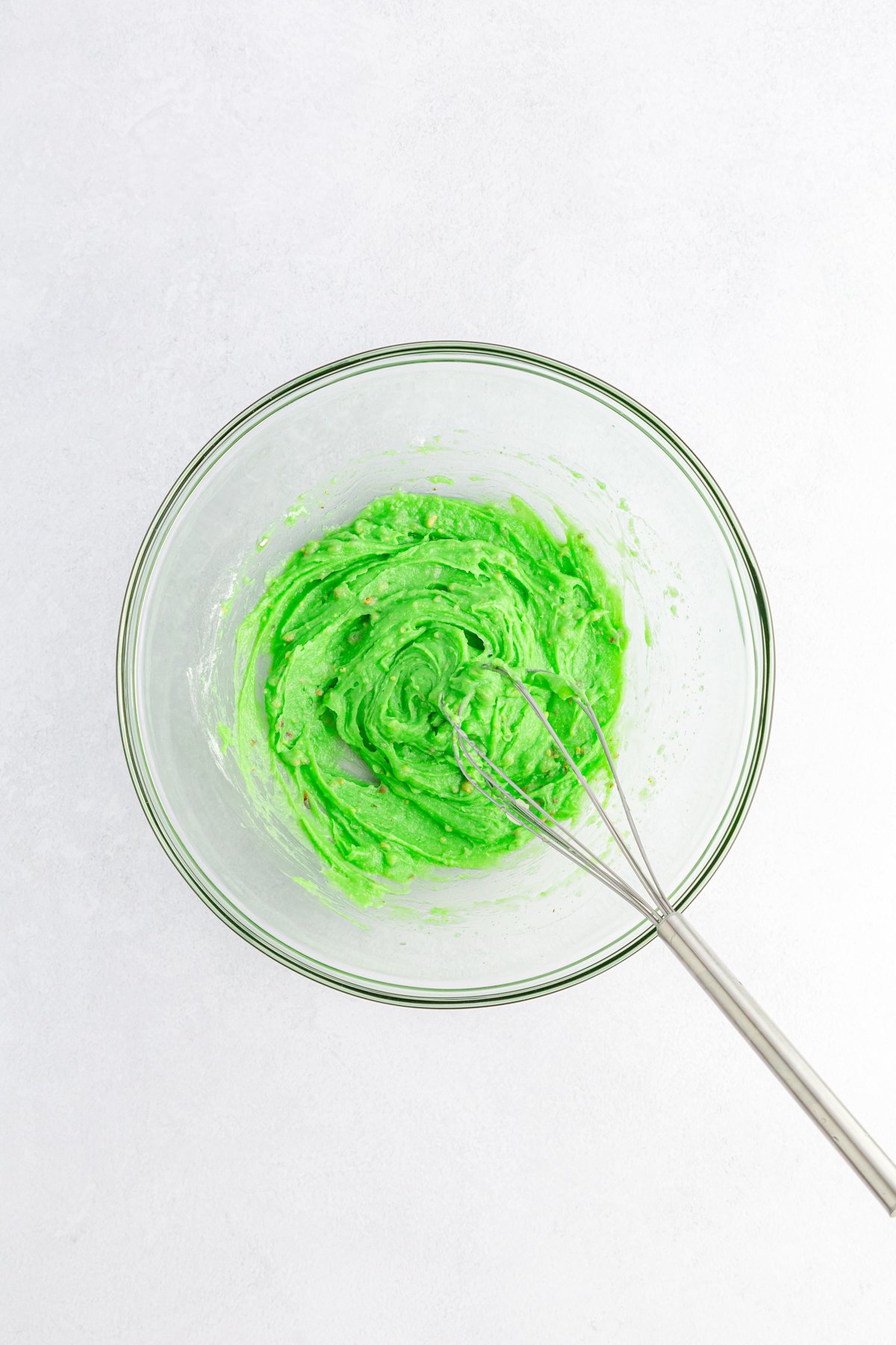 pistachio pudding in a glass bowl