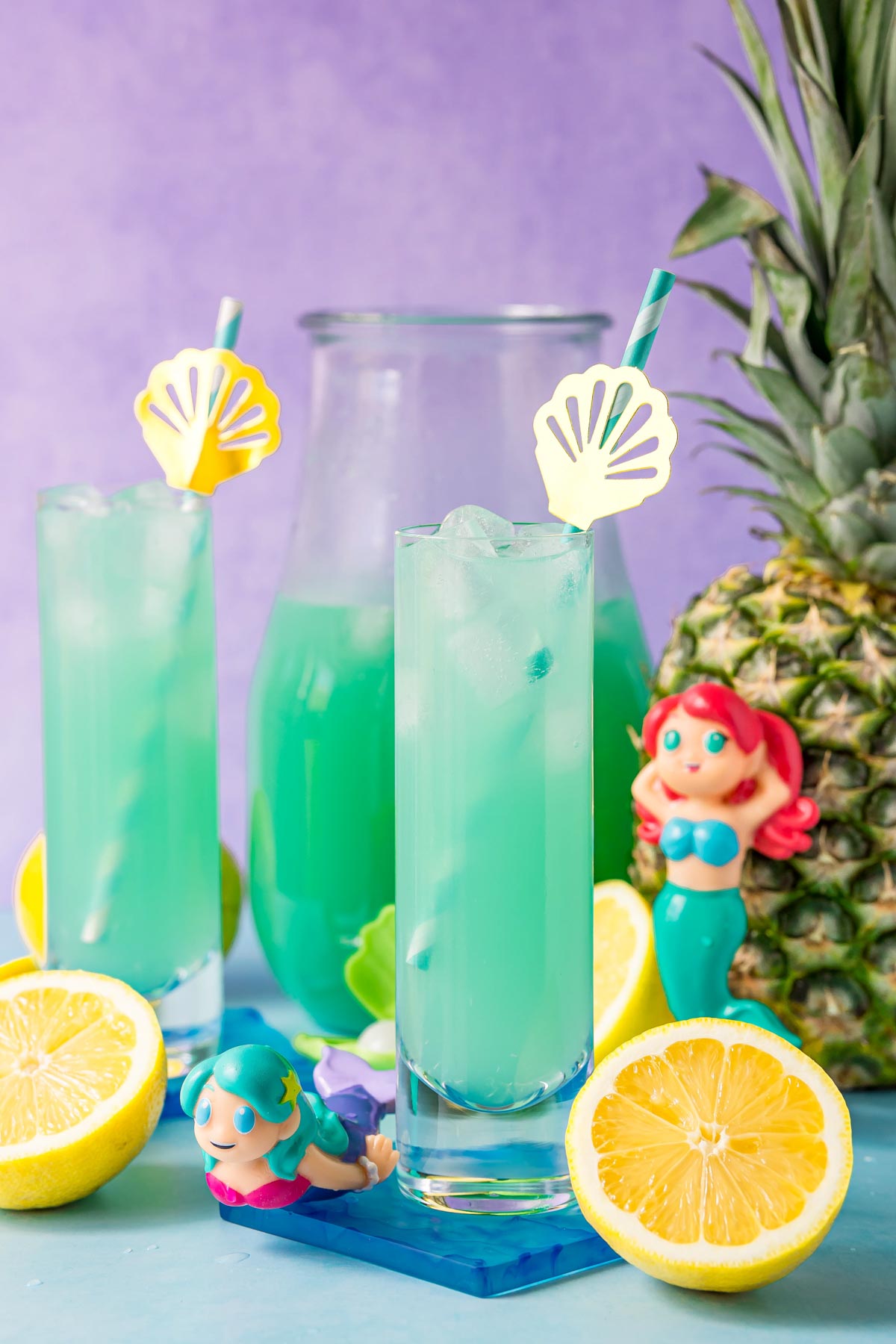 glasses of mermaid punch with straws