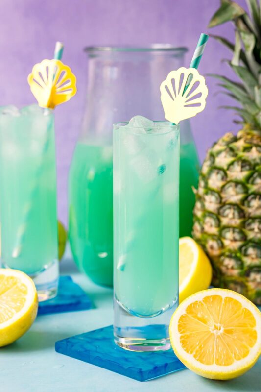 glasses of mermaid punch with a pineapple
