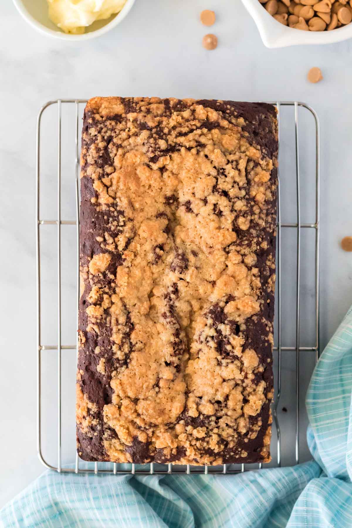 cooling rack with a loaf of peanut butter banana bread