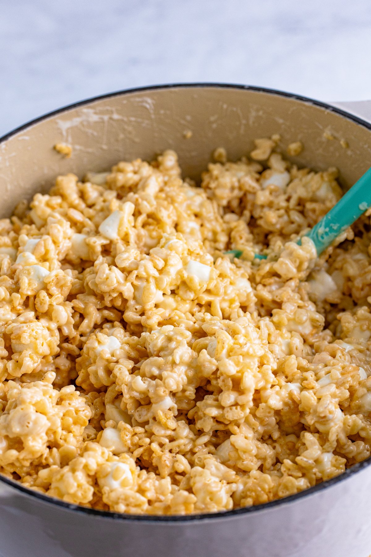 pot full of rice krispie treat mixture