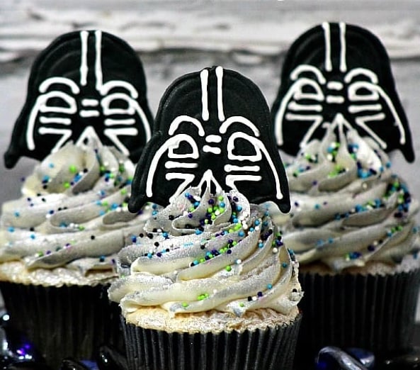 cupcakes with sparkly silver frosting and darth vader toppers