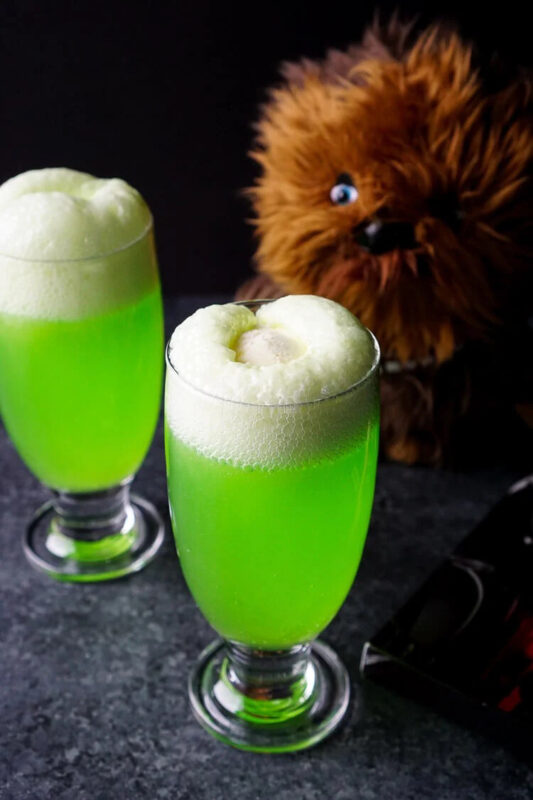 neon green mocktail with chewbacca plush