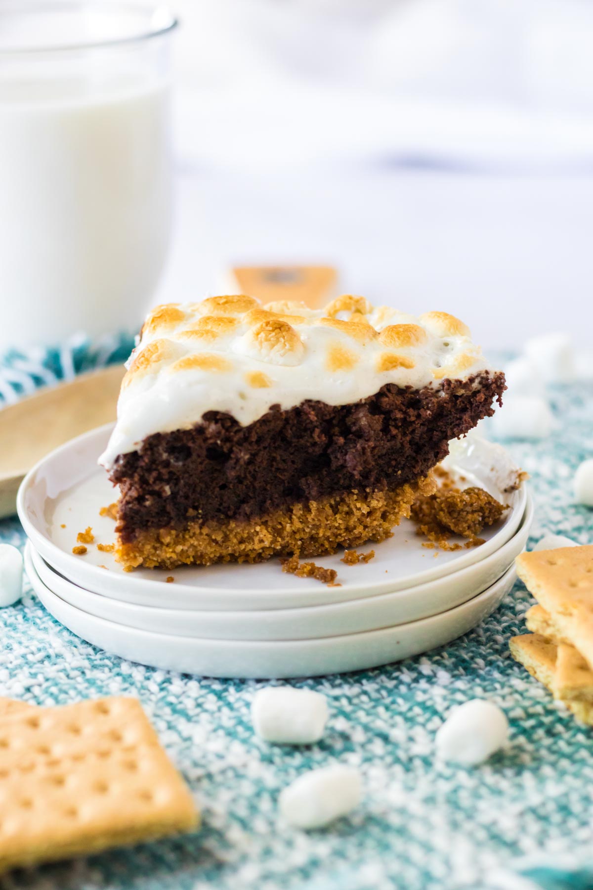 slices of s'mores brownie pie on a white plate