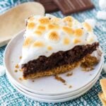 Slice of s'mores brownie pie on a white plate