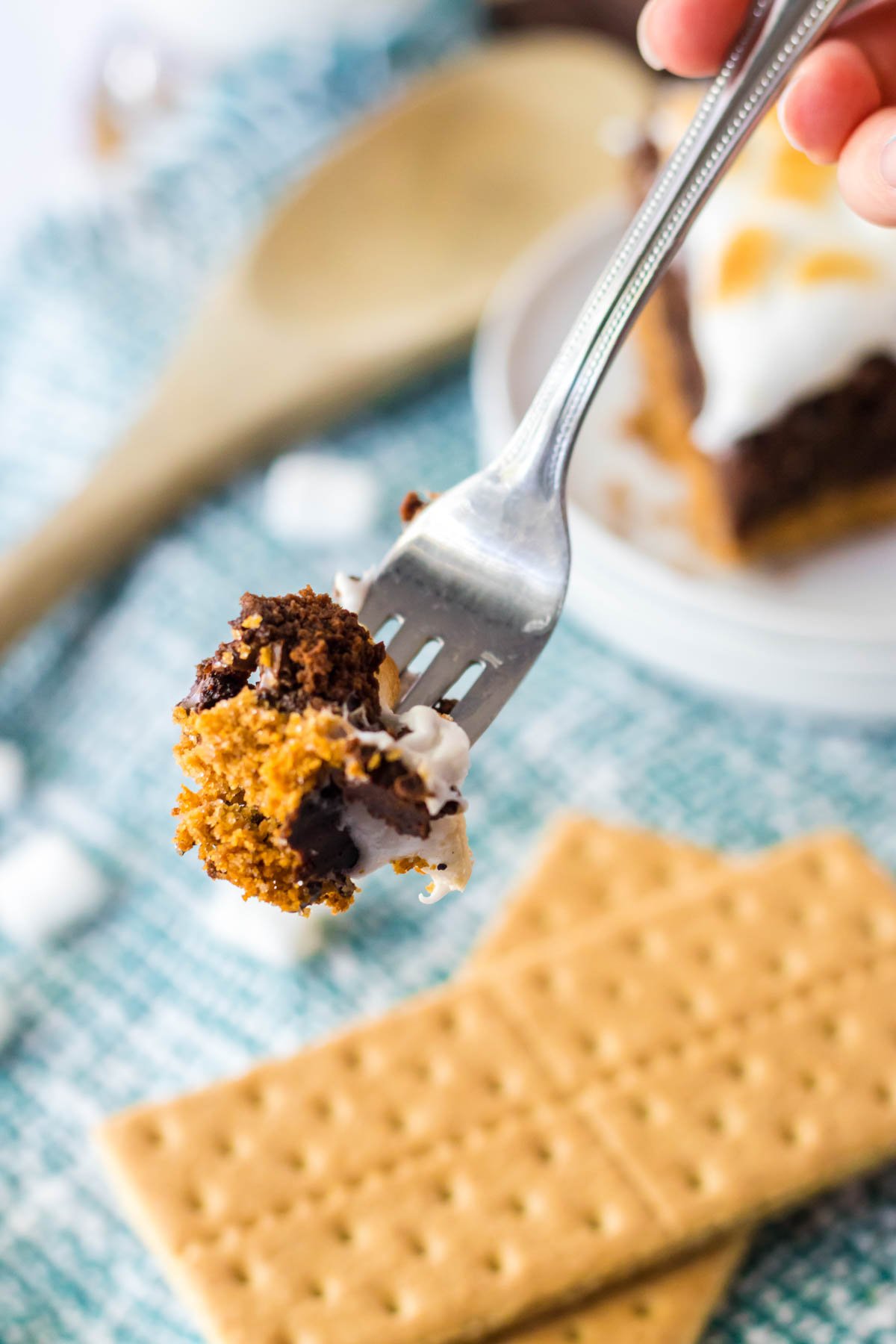 fork with a bite of s'mores brownie pie on it