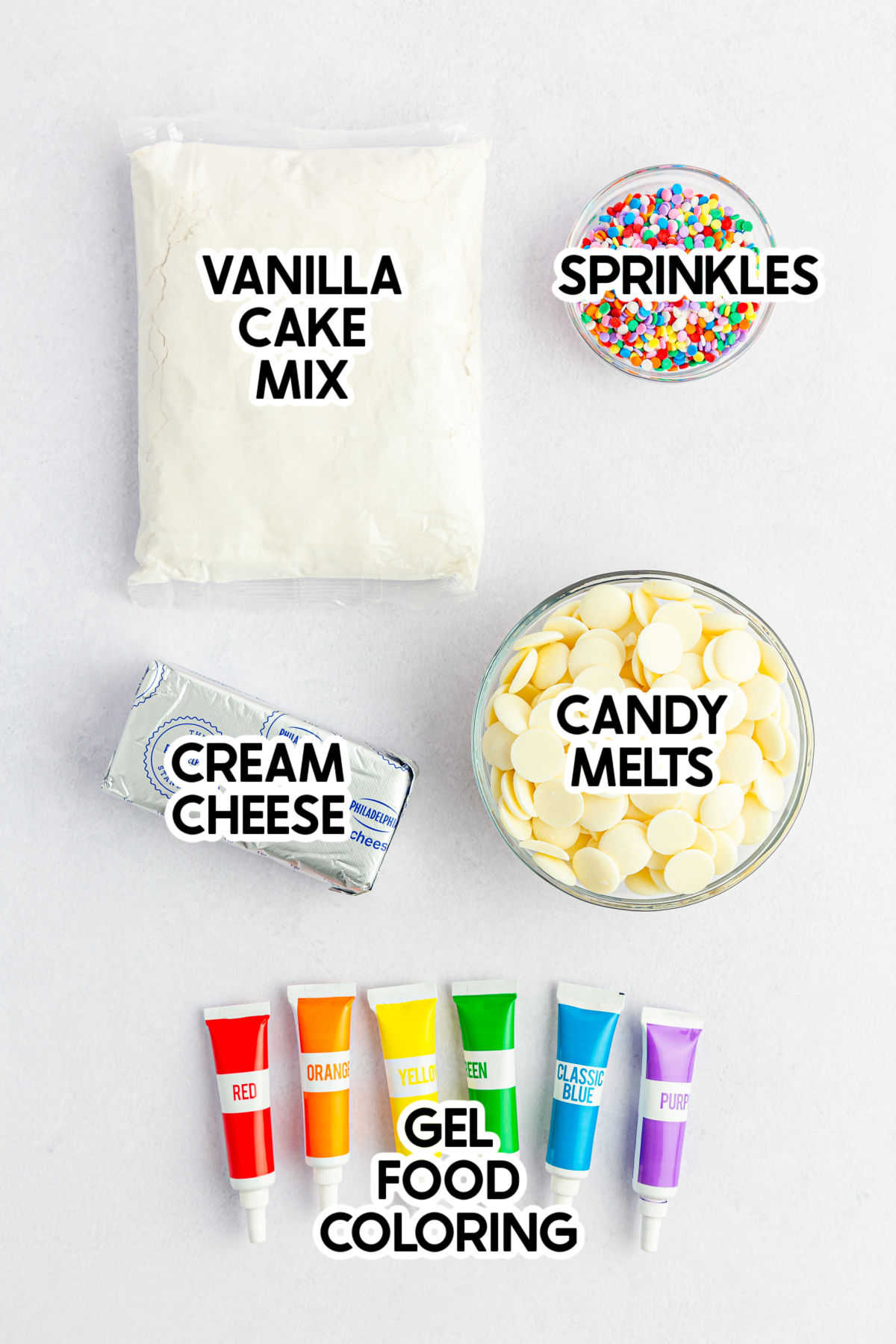 ingredients to make rainbow cake pops with labels
