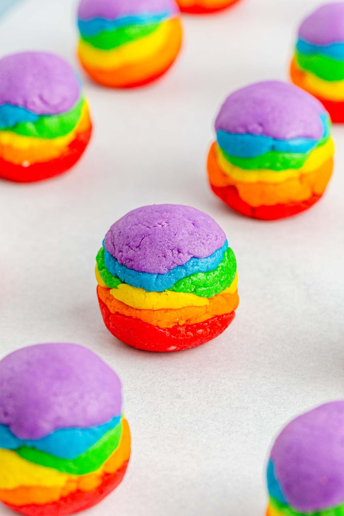 undipped rainbow cake pop on a baking sheet