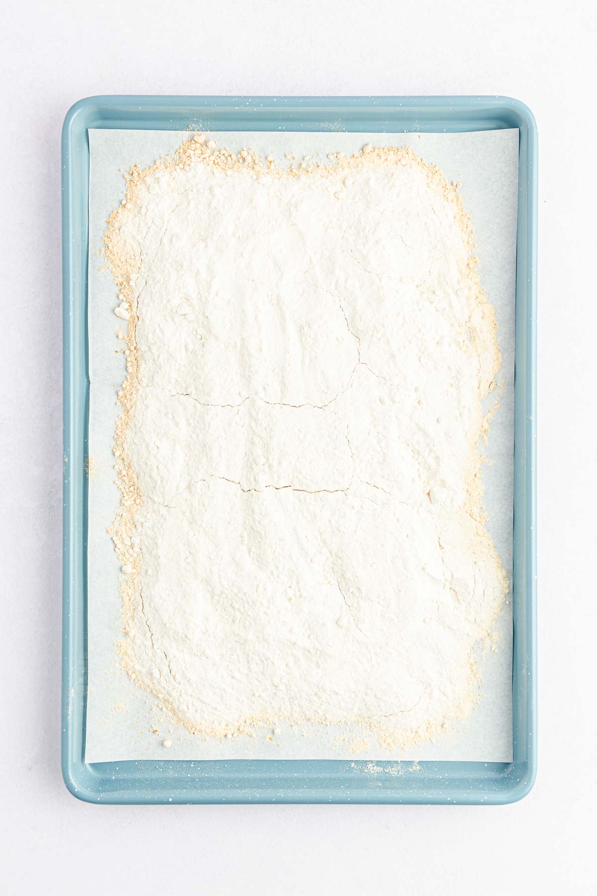 white cake mix on a baking sheet