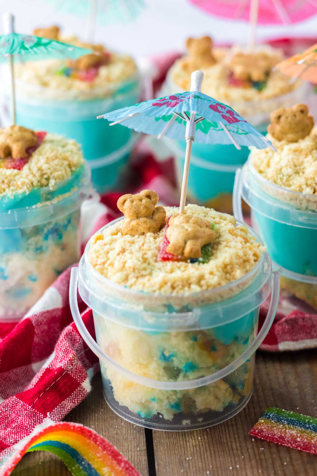 sand pudding dessert in a plastic pail with an umbrella