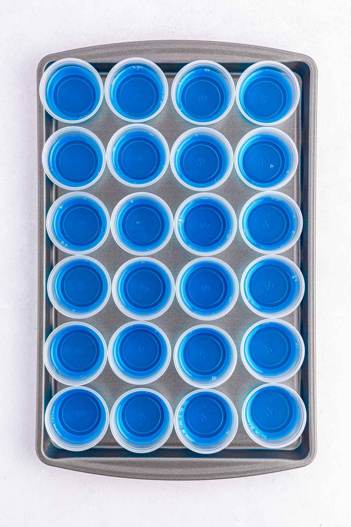 blue jello in little plastic cups
