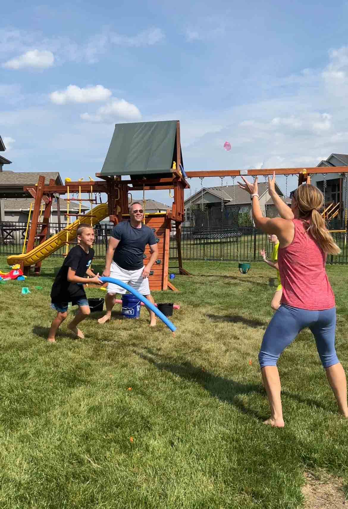 woman catching a water balloon