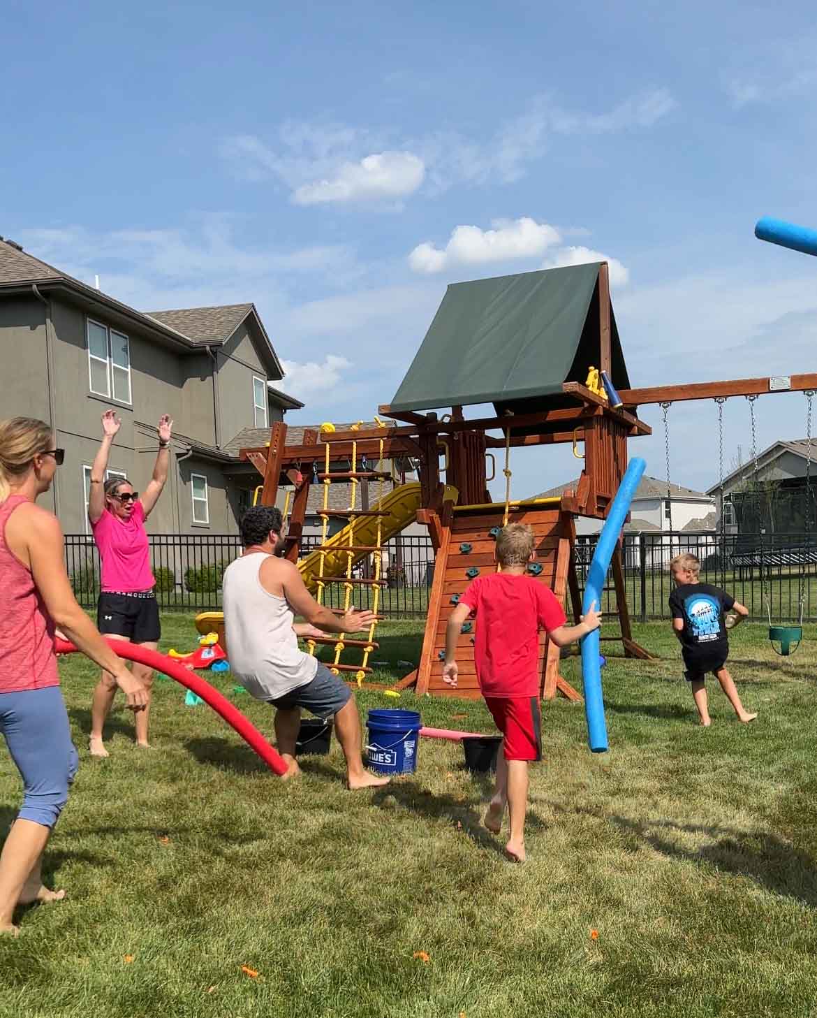 boy scoring a point in a water balloon game