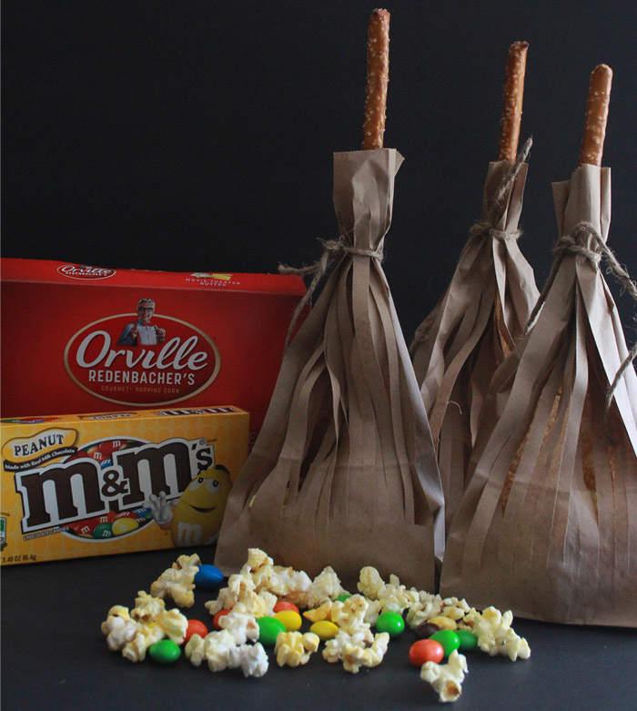 paper bags filled with popcorn and cut to resemble a broomstick