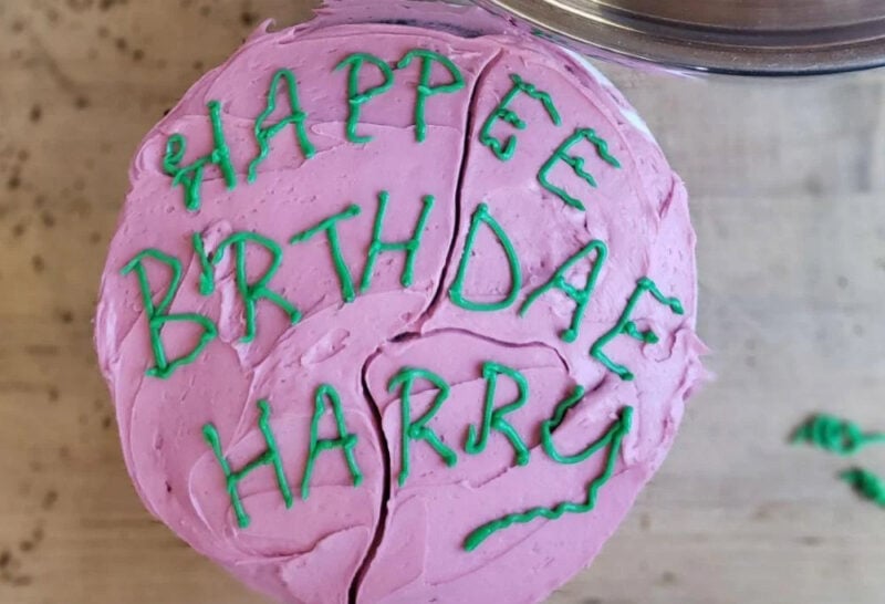 Pink birthday cake with message written on it