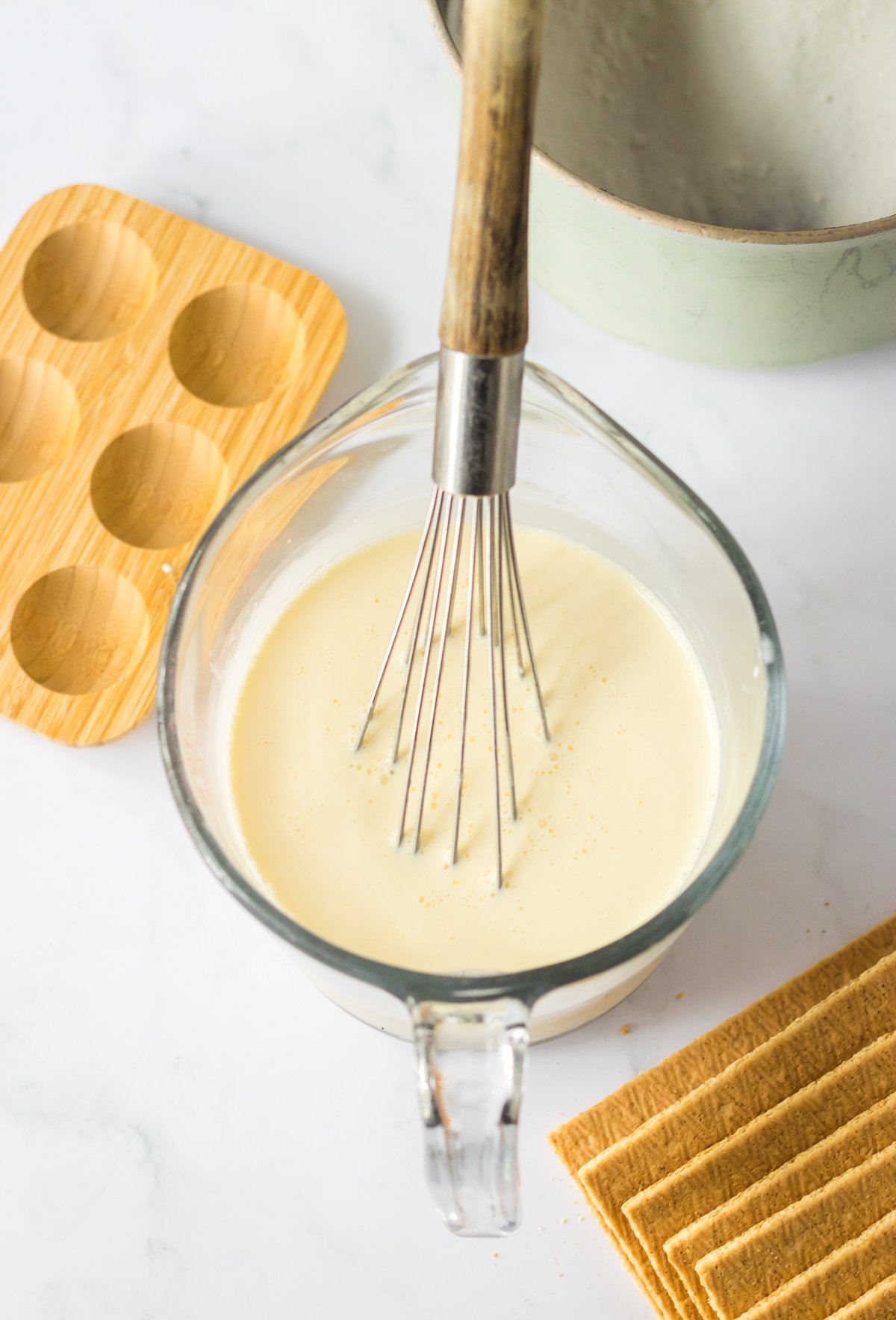 egg yolks and cream in a glass bowl