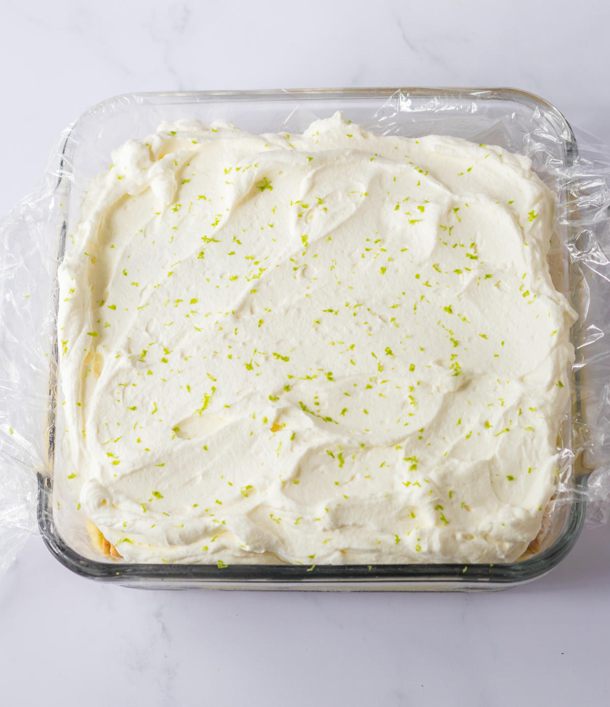key lime cake topped with whipped cream