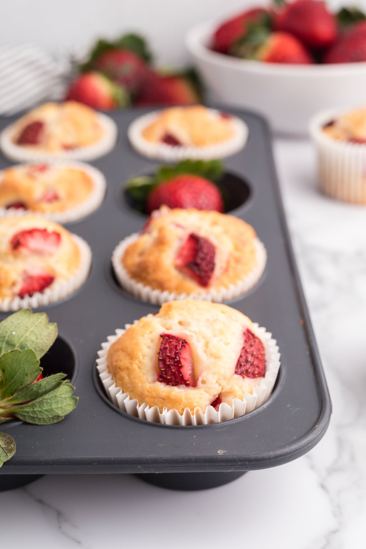 baked strawberry muffins in a pan